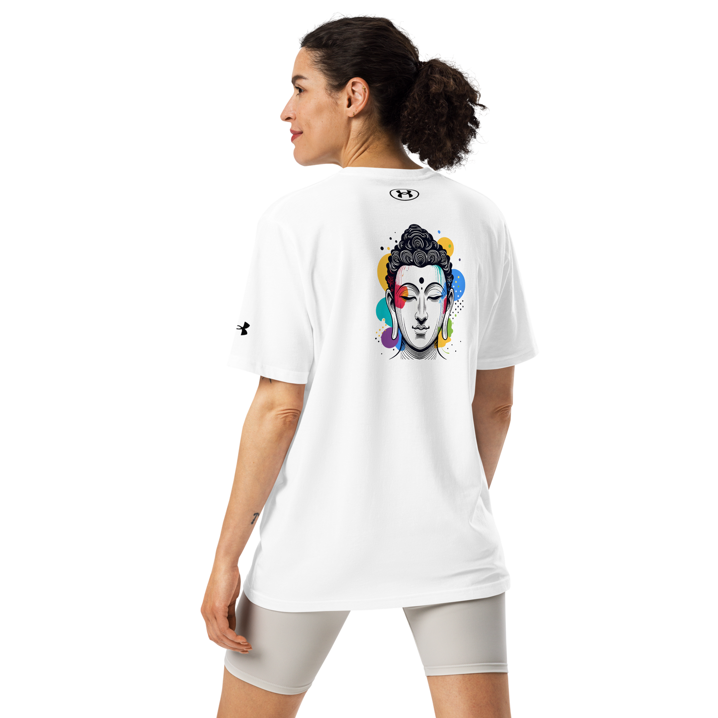 Woman wearing Under Armour athletic t-shirt with Buddha design, promoting mindfulness and zen during workouts.